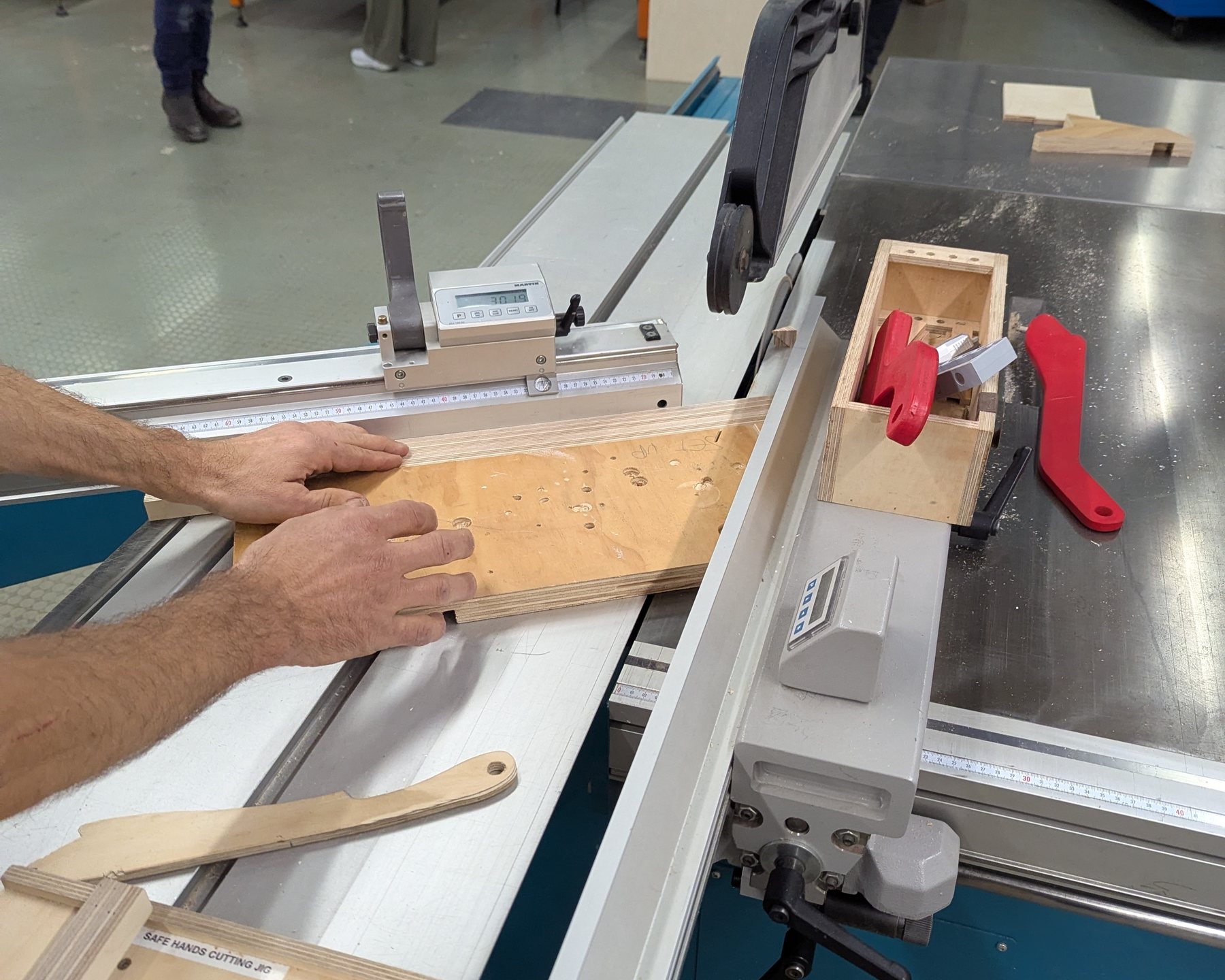Chevron-cut plywood segments and squares laid out on the workbench