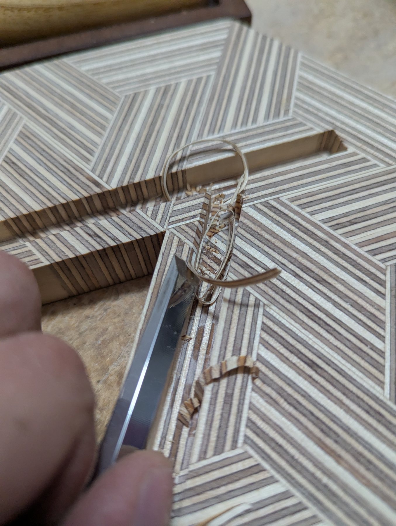 A close up of the leg cutouts being chisled