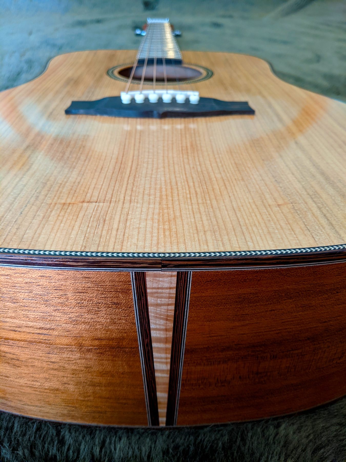Flamed maple and Wenge tail graft on the lower bout